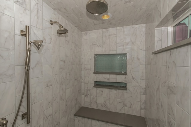 bathroom with tiled shower