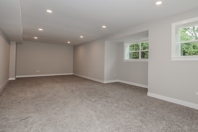 empty room with dark colored carpet