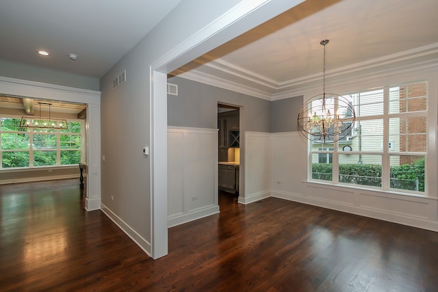 interior space featuring an inviting chandelier, a healthy amount of sunlight, and dark wood-type flooring