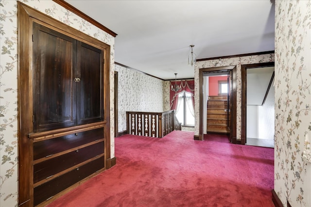 unfurnished bedroom with crown molding and carpet flooring