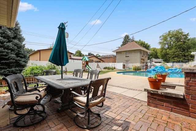 view of patio / terrace featuring a fenced in pool