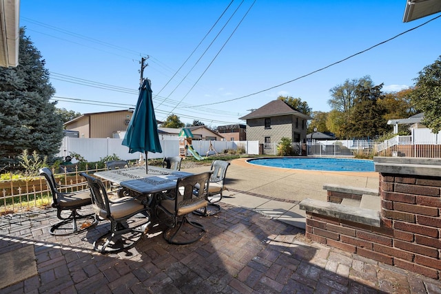 view of swimming pool with a patio area