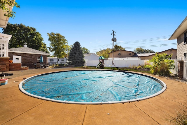 view of swimming pool with a patio area