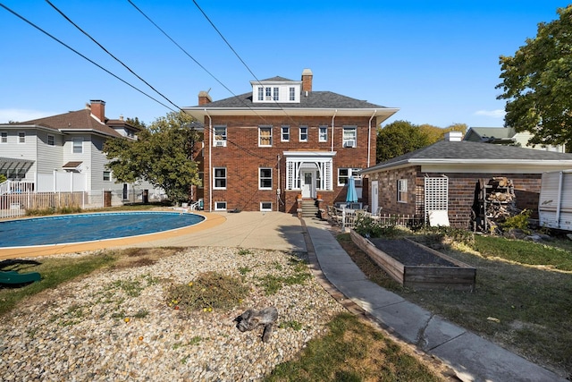 back of house with a patio area and french doors