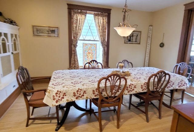 dining area with light wood-type flooring