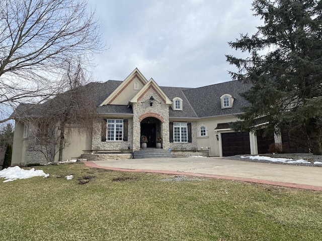 view of front of house with a garage and a front yard