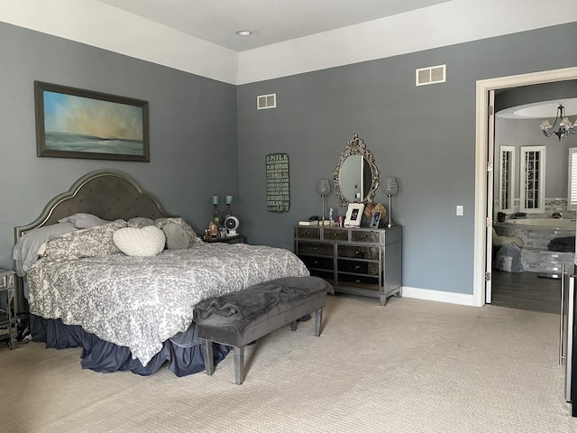 carpeted bedroom with a chandelier