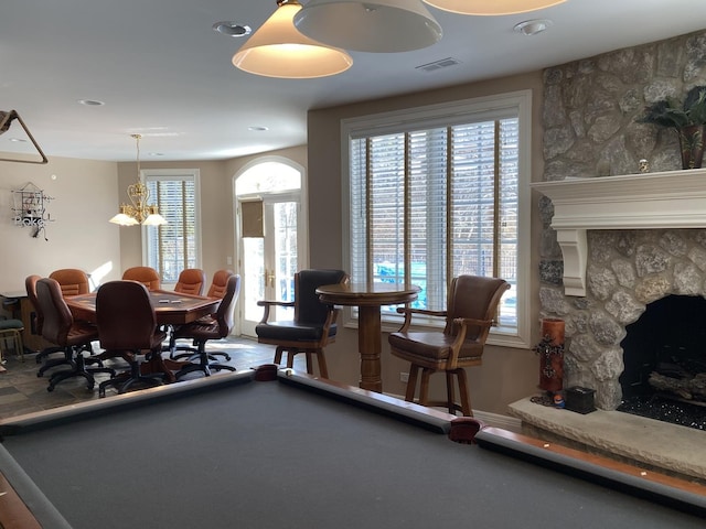 playroom featuring a fireplace and french doors