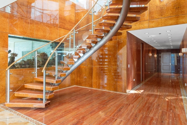 staircase featuring hardwood / wood-style floors