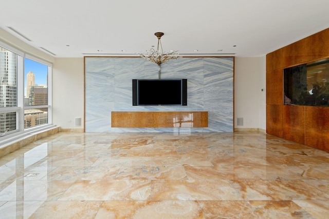 unfurnished living room with a chandelier