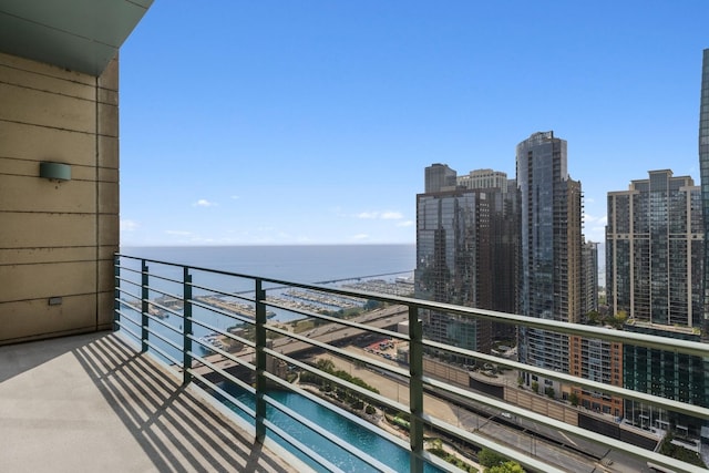 balcony featuring a water view