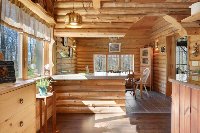 interior space featuring rustic walls and vaulted ceiling