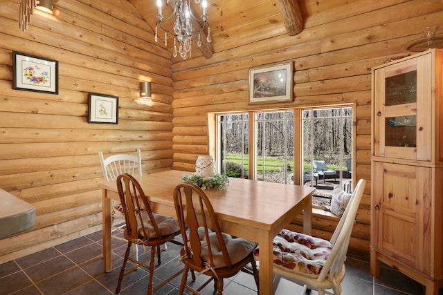 dining area with a notable chandelier, dark tile floors, wood ceiling, and log walls