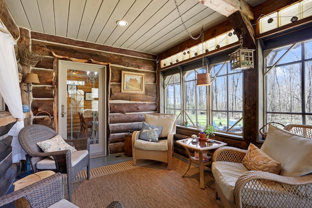 sunroom with wood ceiling and french doors