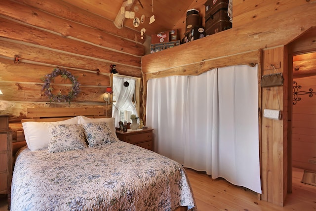 bedroom featuring lofted ceiling, wooden ceiling, and light hardwood / wood-style flooring