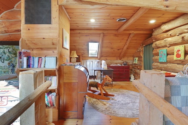 office space with wood walls, wood ceiling, light hardwood / wood-style floors, and lofted ceiling with skylight