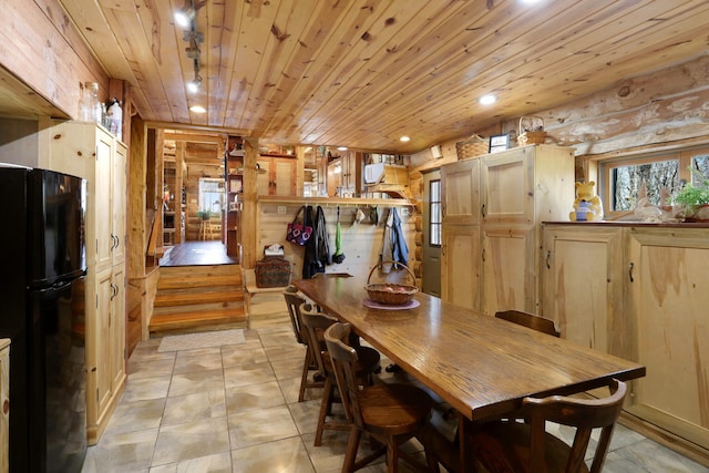 dining area featuring wooden ceiling, wood walls, and light tile floors