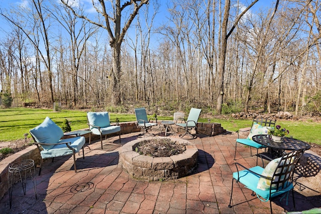 view of terrace featuring an outdoor fire pit