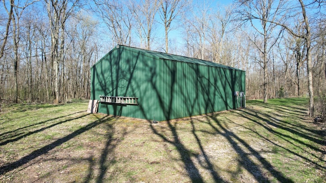 view of shed / structure featuring a yard