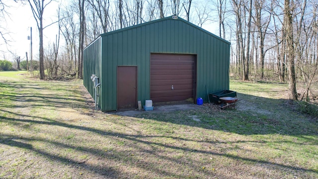 garage featuring a lawn