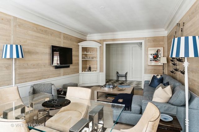 interior space with wooden walls and ornamental molding