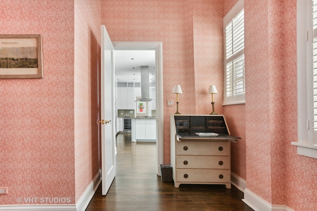 hall with dark hardwood / wood-style flooring