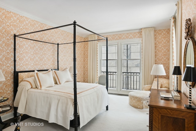 carpeted bedroom featuring ornamental molding and access to outside