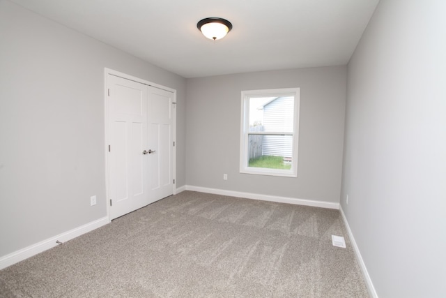 unfurnished room with carpet