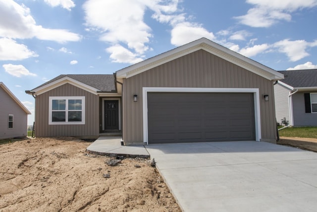 ranch-style home featuring a garage