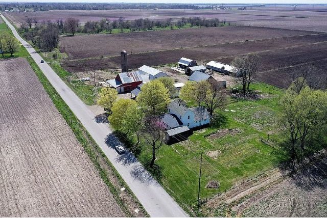 birds eye view of property with a rural view