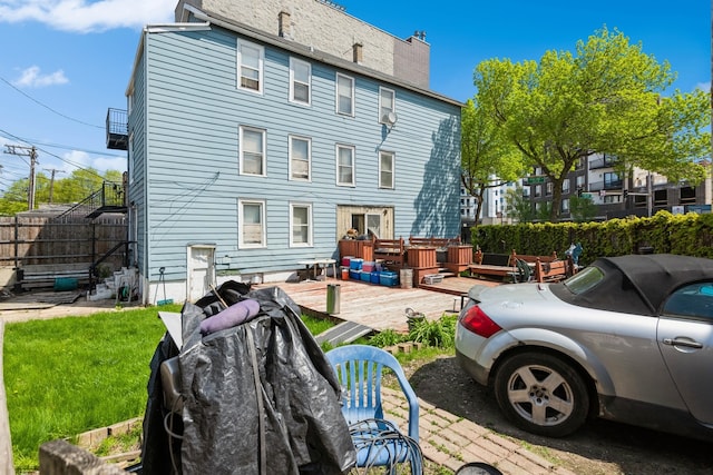 612 N Ogden Ave, Chicago, IL 60642 - rear view of house featuring a deck
