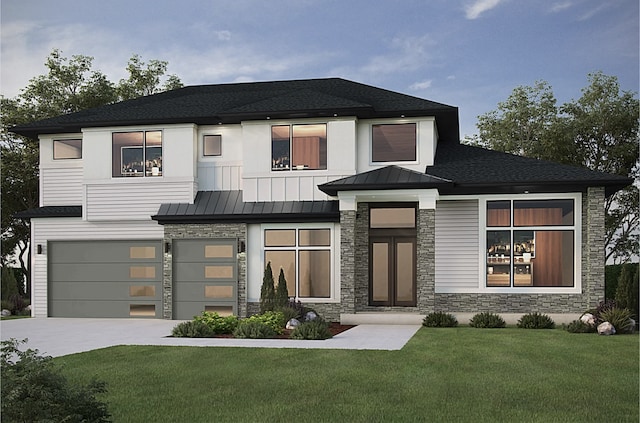 view of front of home with a front lawn and a garage