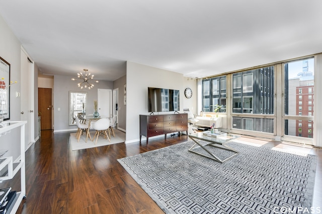 living room featuring a notable chandelier and dark hardwood / wood-style flooring