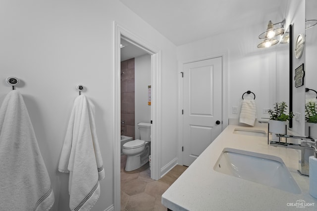 bathroom featuring double sink vanity, tile flooring, and toilet