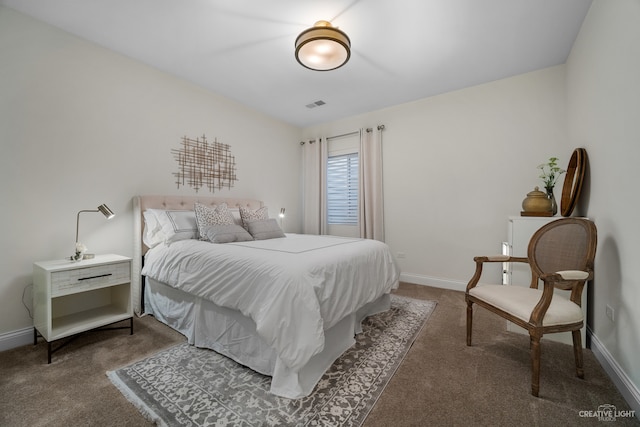 bedroom with dark carpet