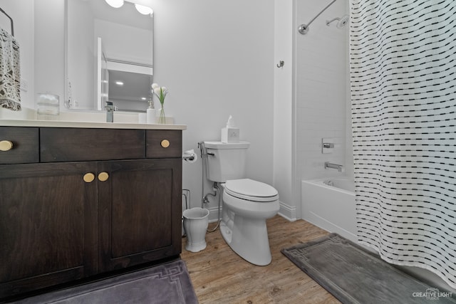 full bathroom featuring shower / bathtub combination with curtain, vanity, toilet, and hardwood / wood-style flooring