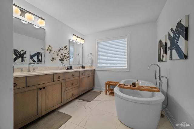 bathroom with a bathtub, oversized vanity, dual sinks, and tile flooring