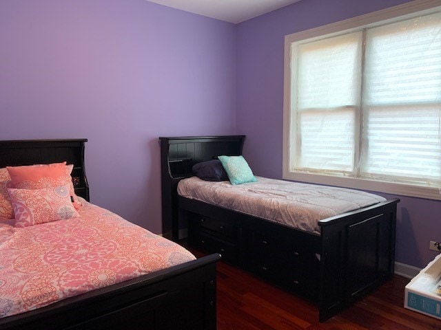 bedroom featuring dark hardwood / wood-style floors