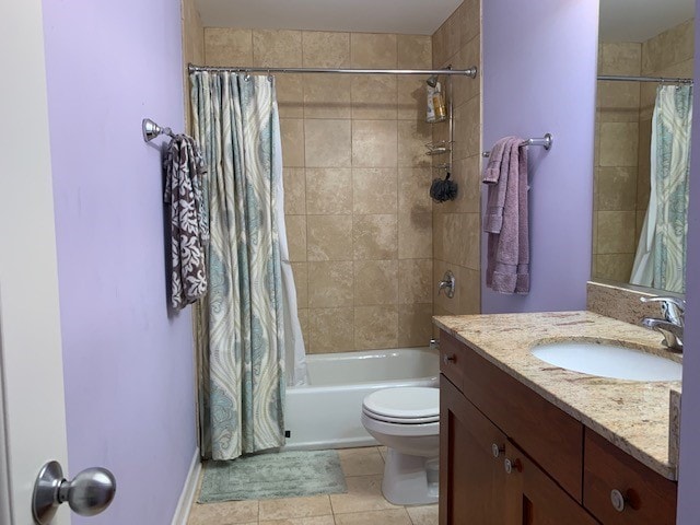 full bathroom featuring toilet, tile flooring, large vanity, and shower / bath combo