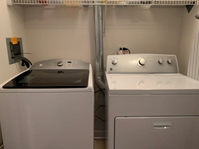 washroom with washing machine and clothes dryer and hookup for a washing machine