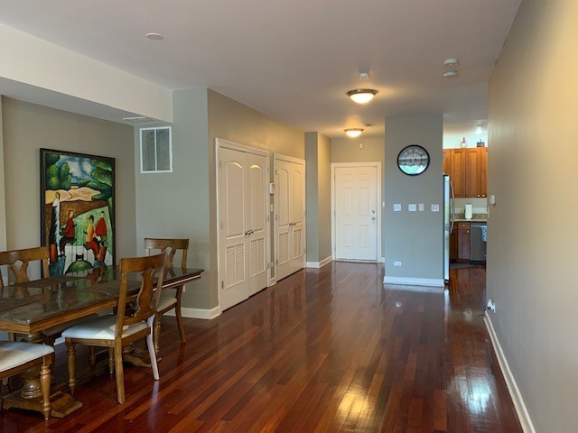 dining area with dark hardwood / wood-style floors