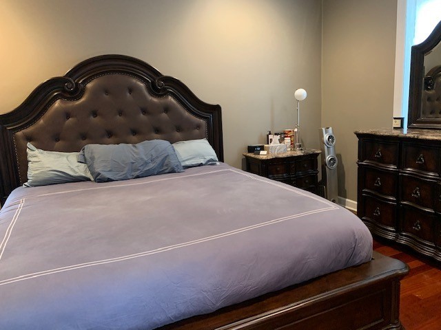 bedroom featuring dark wood-type flooring