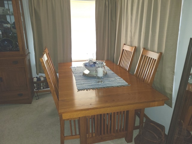 view of carpeted dining space