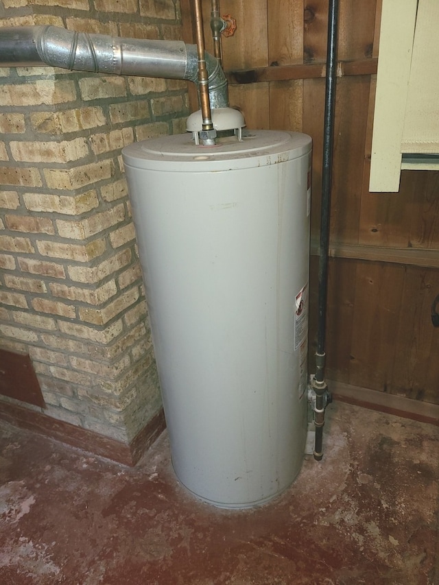 utility room with gas water heater