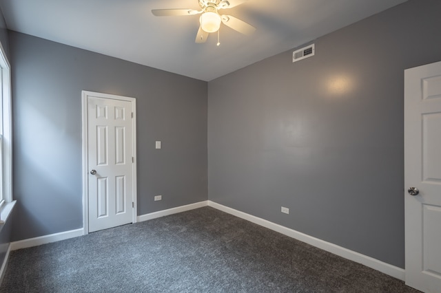 carpeted empty room with ceiling fan