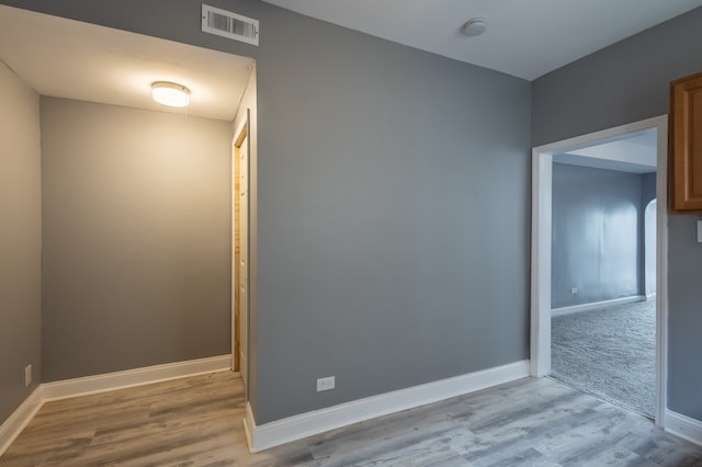 spare room with light hardwood / wood-style flooring