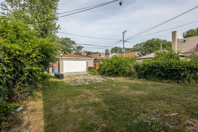 view of yard featuring a garage