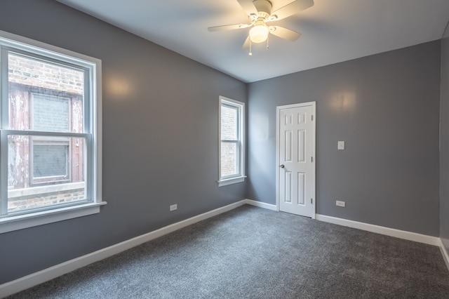 carpeted empty room with ceiling fan