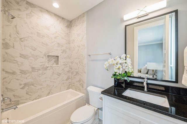 full bathroom with crown molding, vanity, tiled shower / bath combo, and toilet