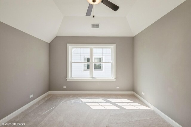1062 Livingston Ave, Highland Park, IL 60035 - spare room featuring light carpet, vaulted ceiling, and a ceiling fan